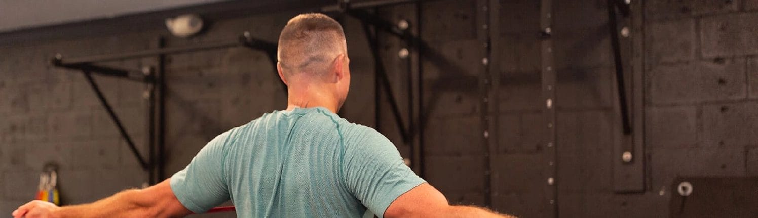Man lifting weights during personal training session