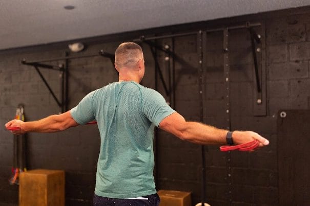 man raise hand like wings